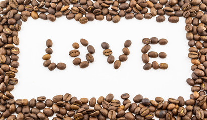 Coffee beans and the word love on a white background