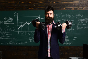 Help can get student back on track. Attentive teacher talking to her student in science class at the university. Business tutor typing on laptop at workplace in classroom.