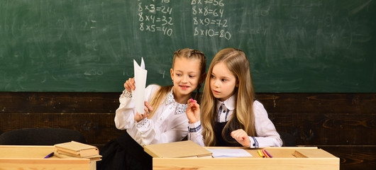teamwork. teamwork of two school girls. teamwork and collaboration. teamwork of happy little girls at school. successful team at work.