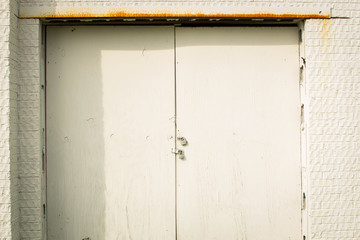 Locked up white shed doors