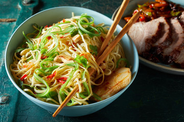 Roasted noodles, garlic and vegetables in a bowl