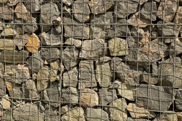 gray brown texture of metal mesh and gray stones