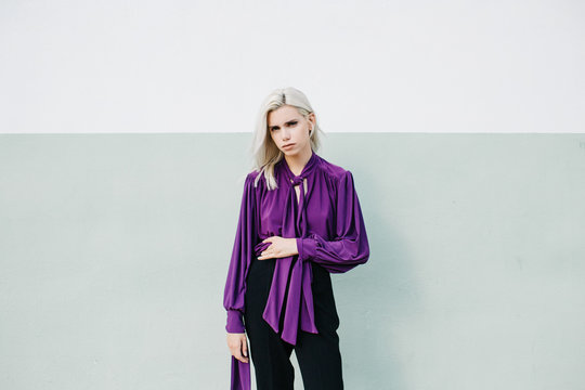 Woman posing in purple blouse