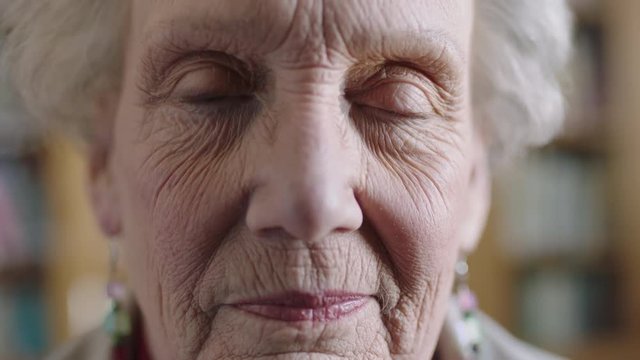close up portrait of confident elderly caucasian woman looking at camera peaceful calm 