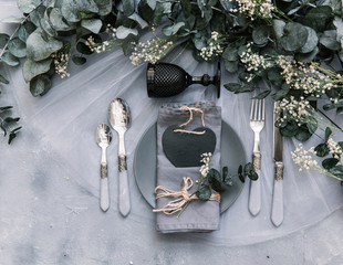Top view wedding rustic table with eucalyptus. Tableware