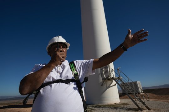 Engineer talking on a walkie talkie