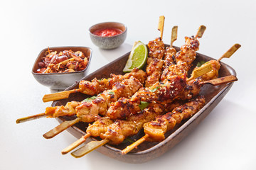 Dish of Grilled Meat on Wooden Skewers with Lime