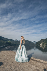 Fototapeta na wymiar Blond woman posing near Alpsee