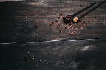 Spices in wooden spoons on a wooden background. Colorful spices in wooden spoons