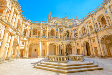 Portugal, Tomar. Bottom view of claustro de D. Joao III, courtyard with fountain of Convent of Christ in Templar Castle. Unesco Heritage and popular destination in Europe.