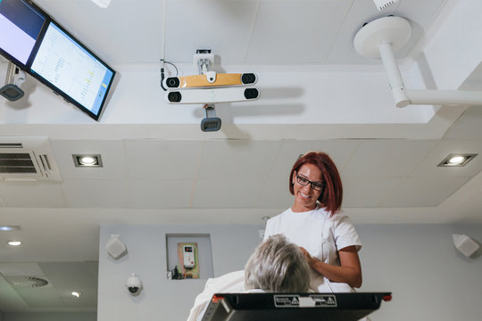 Smiling woman medic making treatment