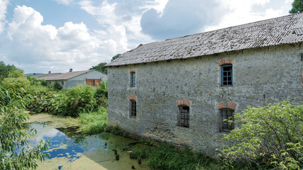 Fototapeta premium Old mill, on the bank of the river