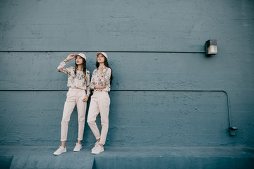 Two Women in Matching Pink Outfits