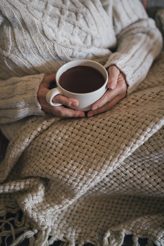 Woman holding hot cocoa