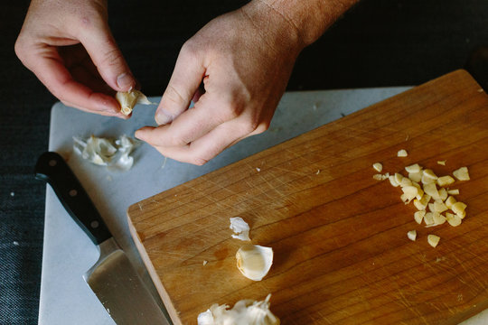 Man Cutting Garlic
