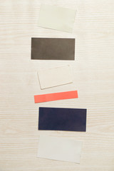 Various blank papers on the wooden background