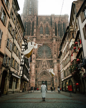 Woman standing at old cathedral