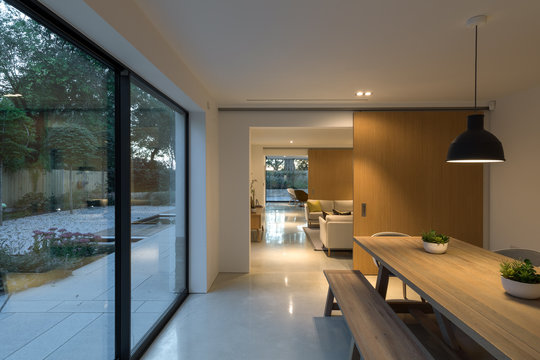 Evening picture through the interior of a modern house illuminated.