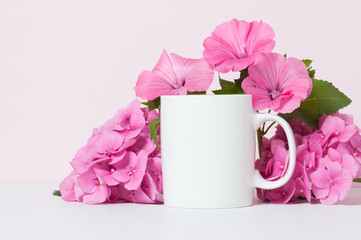 blank white coffee mug mock up with pink flowers