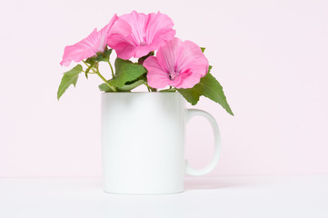 blank white coffee mug mock up with pink flowers