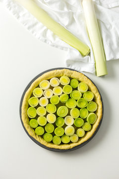 Leeks in a pastry case, overhead