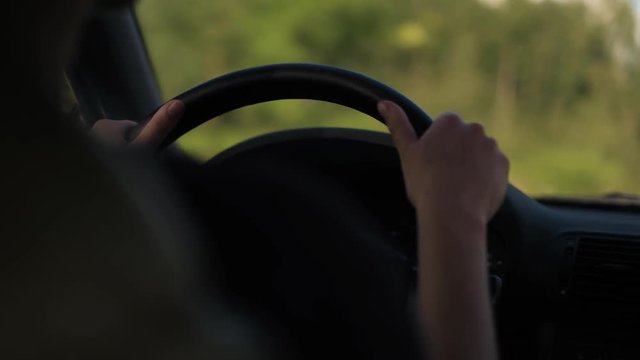 Young Girl Driving A Car, Travel Concept, Close Up On Womans Hands Shot In 4K UHD