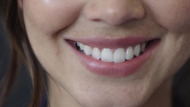 close up woman mouth smiling happy showing healthy white teeth dental health concept