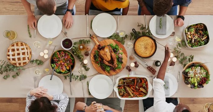 top view of young multi ethnic friends preparing table enjoying thanksgiving lunch together talking bonding over healthy meal time lapse