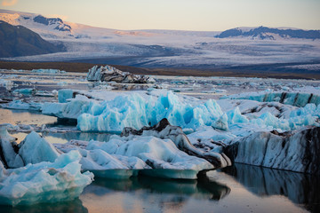 Fototapeta na wymiar Icebergs in Jokulsarlon glacier lagoon. Vatnajokull National Park, Iceland Summer.Midnight Sun.