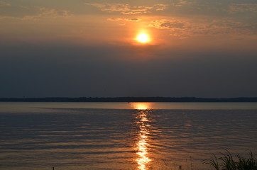 reflection of a sunset off a lake