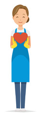 A woman wearing a blue apron and rubber gloves has a heart mark