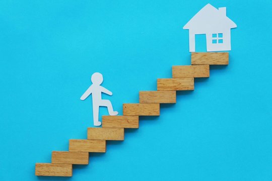 Paper Man Or Woman Climb Up To House,success Stair Step.Goals Concept. 