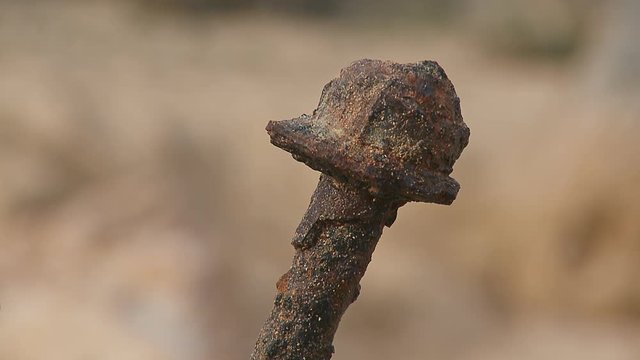 Very close shot of a corroded debris / bolt from a stranded ship