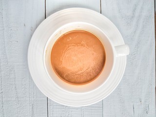 coffee cup on white wooden background
