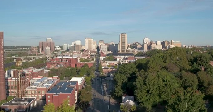 Drone Fly Past Statue Towards City