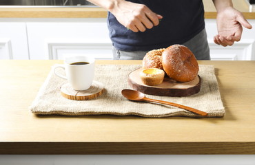 Close up view of bakers are working. Homemade bread. Eating breakfast with bread on the island table in the dining room. Morning coffee.