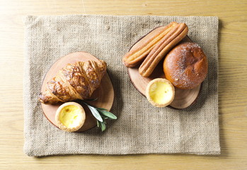 Close up view of bakers are working. Homemade bread. Eating breakfast with bread on the island table in the dining room. Morning coffee.