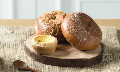 Close up view of bakers are working. Homemade bread. Eating breakfast with bread on the island table in the dining room. Morning coffee.