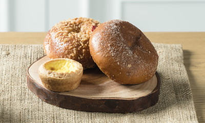 Close up view of bakers are working. Homemade bread. Eating breakfast with bread on the island table in the dining room. Morning coffee.