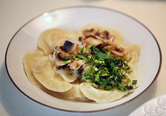 Photo of a bright macro of delicious dumplings with potatoes