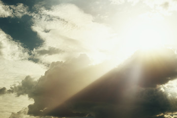 Dramatic apocalyptic clouds background with light rays