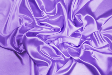 Fototapeta premium Purple luxury satin fabric texture for background