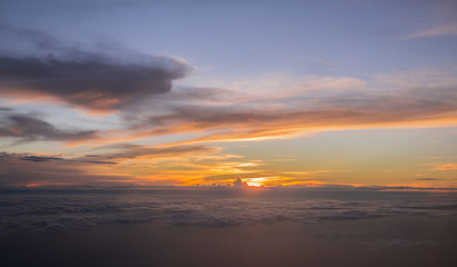 Fototapeta na wymiar Sunset Above the cloud, capture from window aircraft.