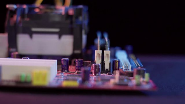 Close up view of an old pentium motherboard. The depth of field is short and has some rack focusing. The lighting is high contrast and still has room for color correction.