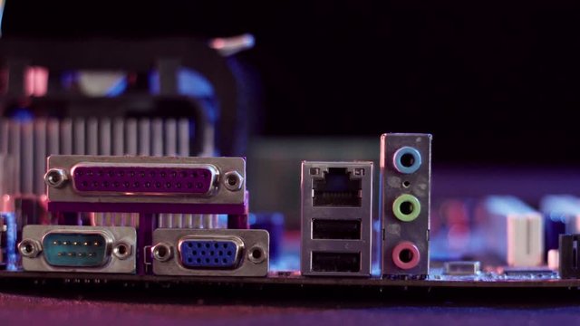 Close up view of an old pentium motherboard. The depth of field is short and has some rack focusing. The lighting is high contrast and still has room for color correction.