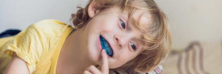 Three-year old boy shows myofunctional trainer to illuminate mouth breathing habit. Helps equalize...