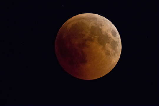 Lunar Eclipse: phase of  blood moon completely covered by  shadow of the Earth from the sun