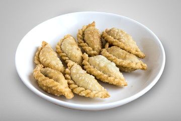 Gujiya is a sweet deep-fried dumpling served during festivals of Holi and Diwali