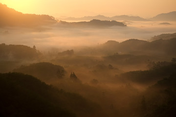 Sunset mountain silhouette fog
