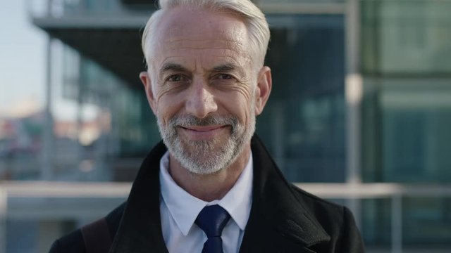 portrait of corporate businessman smiling close up of mature leader ceo